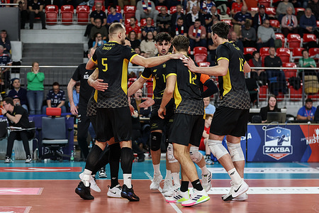 Players of Skra Belchatow celebrate after winning a point during the PlusLiga match between Zaksa Kedzierzyn-Kozle and Skra Belchatow at Hala Azoty. FInal Score; Zaksa Kedzierzyn Kozle 3:1 (19:25, 31:29, 25:21, 25:218) Skra Belchatow.