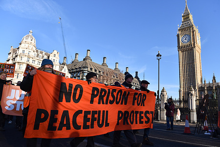 Protesters hold a banner which states "No Prison For Peaceful Protest", during the demonstration at Parliament Square. Climate activists from Just Stop Oil marched from Parliament Square to the Home Office in London. The activists demand the release of imprisoned activists, and to stop all future licensing for the exploration and development of fossil fuels in the UK.