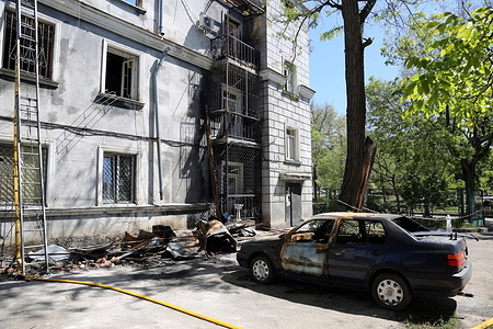 General view of a house damaged by Russian shelling and a burnt-out car on Kosvennaya Street. At Least 15 people were injured and 2 dead as a result of the attack on Odessa on 01.05.2025, 200 people evacuated from the houses which were under under the attack.