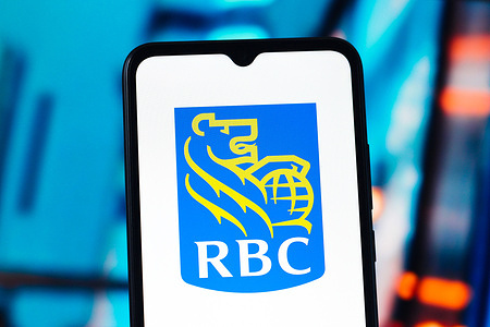 In this photo illustration, the RBC Capital (Royal Bank of Canada) logo is seen displayed on a smartphone screen.