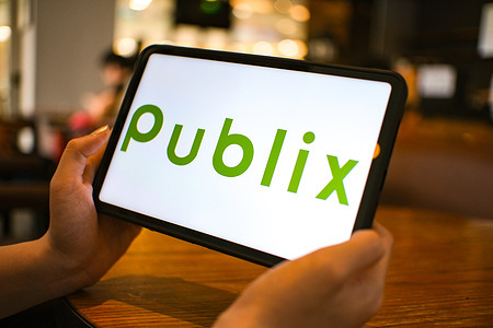 In this photo illustration, the Publix logo is seen displayed on a tablet screen.