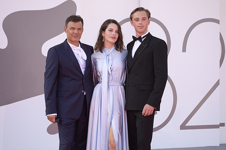 (L-R) Francois Ozon, Rebecca Marder and Benjamin Voisin attend the "L' etranger" red carpet during 82 Venice Film Festival at Palazzo del Cinema.