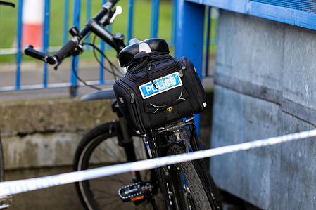 A police bike is seen within a crime scene in Enfield, north London.