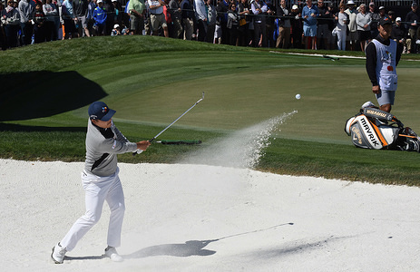 Kyoung-Hoon Lee of South Korea plays a shot from a bunker on the ninth hole during the third round of the Arnold Palmer Invitational golf tournament at the Bay Hill Club & Lodge in Orlando.