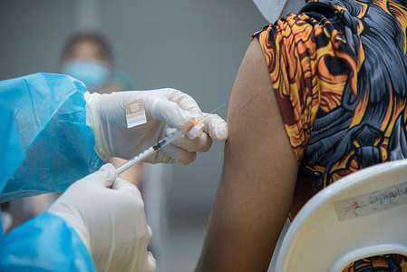 A health worker administers a dose of Moderna Covid-19 vaccine to a man at the Bang Sue Grand Station, Bangkok. 
Thailand has accelerated Covid-19 vaccination shots and booster shots to contain the surge of COVID-19 coronavirus infections linked with the Omicron variant after the New Year holiday.
Thailand's Ministry of Health reported that more than 2,338 cases of Omicron had been discovered in Thailand.