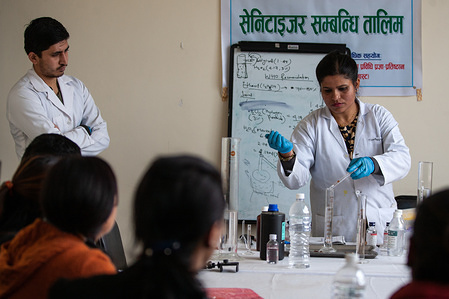 A scientist Richa Gupta and her team show the way to prepare Hand Sanitizer using home-brewed alcohol at the Nepal Academy of Science And Technology (NAST).
Lalitpur metropolitan City teaches the local People from 29 different Ward's around Lalitpur area for mass production to overcome the shortage of Hand Sanitizer amid concerns over the spread of coronavirus outbreak.