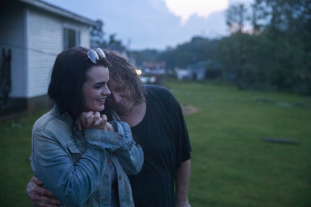 Nicole Rood and her boyfriend Brett Cantrell hug after they survived a tornado in the 6400 block of West Cowden Rd. near Ellettsville. Brett Cantrell survived by hanging onto a tree, and Rood hung onto the handle of the front door of a house. The couple were in their car when the storm stuck. The tornado destroyed several homes, tore up trees, and left dangerous live power lines scattered around the area.
