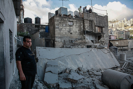 Palestinians inspect a house bombed during a military operation in the West Bank city of Nablus. Israeli forces blew up the home of Palestinian Jaafar Muna, who carried out a bombing near a synagogue in Tel Aviv on August 18, 2024. The Shin Bet security service and the Israeli government announced the demolition of 40 Palestinian homes in the Palestinian Authority territories.