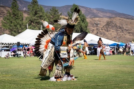 A young Native American dancer performs in the arena during the San Manuel Pow Wow. Native American dancers, singers and drum groups gathered during the San Manuel Pow Wow at California State University, San Bernardino. The three-day event brings together participants from across the United States and Canada for traditional dancing, singing, drumming and cultural activities, celebrating Native American culture, community and traditions.