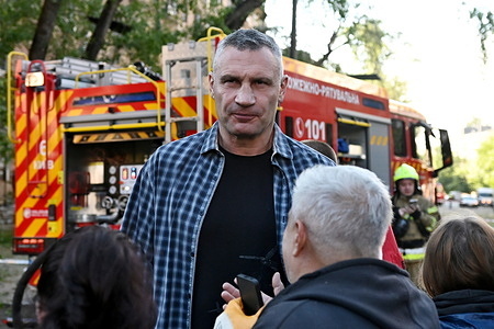 Kyiv Mayor Vitaliy Klitschko speaks to residents near a damaged building after Russian strikes in Kyiv. A large ballistic missile attack pounded Kyiv early on May 24, authorities said, wounding at least five people after Moscow threatened retaliation for strikes in Russian-occupied eastern Ukraine.