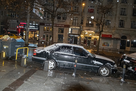 A car covered in snow. Snowfall has begun in Istanbul.