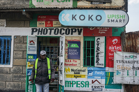 A man walks in front of a KOKO Gas filling shop in the Top Ten area of Nakuru City. KOKO Networks, a Kenyan clean cooking technology company that provided pay-as-you-go bioethanol fuel as a replacement for charcoal and kerosene, ceased operations in Kenya after failing to obtain necessary authorization to sell carbon credits and import permits.