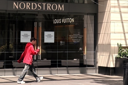 SEATTLE, UNITED STATES - MAY 27, 2020: A man walks by Nordstrom's shuttered flagship store in Seattle.
The luxury retailer is expected to report its first quarter earnings soon. Due to the COVID-19 pandemic, many of the company's locations are closed.