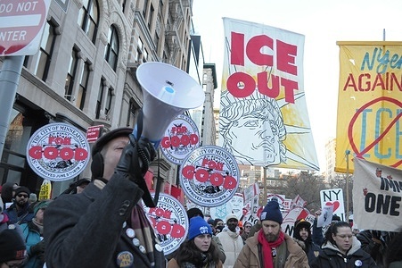 An ICE protester speaks using a megaphone while other ICE protesters hold placards. Demonstrators in Manhattan, New York City protested against Donald Trump’s immigration policies and the U.S. Immigration and Customs Enforcement or ICE for arresting and deporting immigrants. The protest occurred amid other anti-ICE protests happening in cities nationwide. The rallies follow the death of Renee Good at the hands of an ICE agent in Minneapolis. Hundreds of businesses in Minneapolis are planning to close as part of an "economic blackout" to protest the Trump administration's surge in deploying ICE agents to arrest and deport immigrants.