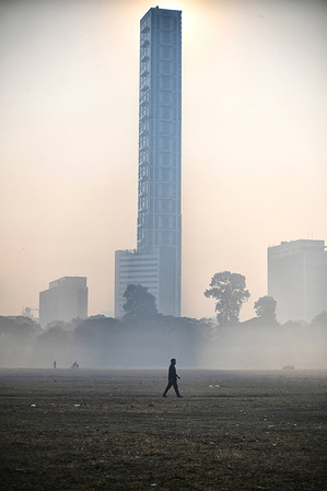 People seen walking into deep fog on a winter morning at Maidan.