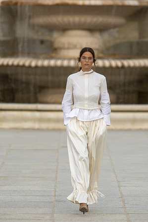 A model walks the runway with the Royal Palace in the background, during the inaugural Madrid es Moda 2025 show at the Plaza de Oriente Gardens in central Madrid. This is the tenth edition of Madrid es Moda and features a presentation by more than 10 local designers who will showcase flamenco fashion, accompanied by more than 30 models.