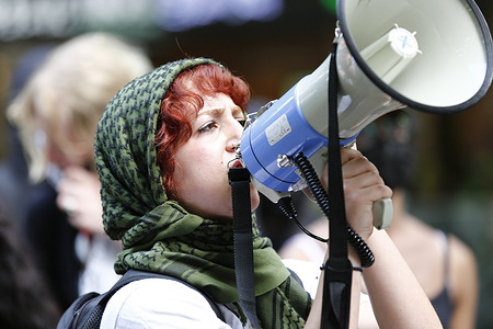 A protester shouts slogans during the rally. Activists gather at Flinders Street Station for the Trans Day of Resistance 2025 rally calling for trans rights and community safety. Demonstrators demand an end to discrimination, expanded access to gender-affirming healthcare and the removal of police from LGBTQ+ events. The rally also expresses solidarity with detained migrants and international human rights causes. Organizers encourage broad participation as part of an ongoing movement for trans liberation.