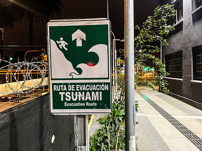 A sign of a Tsunami Evacuation Route is seen. Due to an earthquake in Russia, a tsunami warning has been issued for the Valparaiso region and Chile.