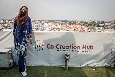 Damilola Teidi, 31, director of the Co-Creation Hub's incubation unit in Yaba, Lagos poses for a photo beside the company's logo.
Yaba is located at the economic capital of Nigeria. The area used to be called "Yabacon Valley" because of the area's mass number of tech start-ups.