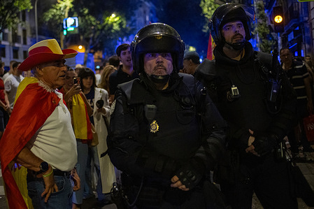 Members of the National Police riot squad seen during a demonstration at the national headquarters of the Spanish Socialist Workers' Party (PSOE) in Madrid. The Spanish far-right party Vox called a demonstration demanding the departure of Prime Minister Pedro Sánchez.