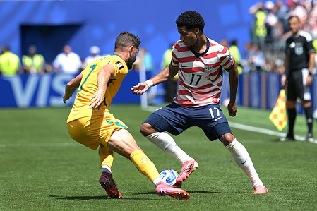 Mathew Leckie (L) of Australia men football team and Malik Tillman (R) of United States men football team seen in action during the FIFA World Cup 2026 first stage Group D match between USA and Australia held at the Seattle Stadium. Final score; USA 2:0 Australia.