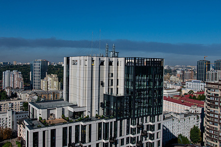 Smoke seen against the backdrop of residential buildings after a drone attack. The Epicenter chain of construction hypermarkets said one of their logistics centers was hit.