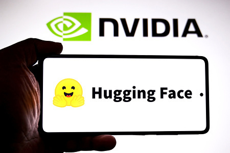 In this photo illustration, a Hugging ​Face logo is seen displayed on a smartphone with a Nvidia logo in the background.