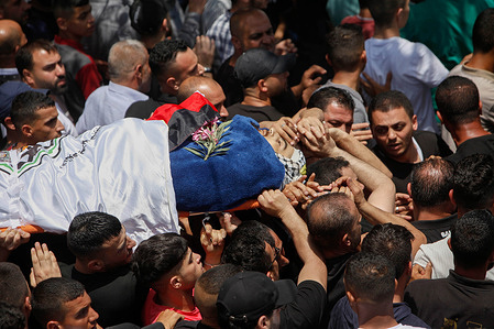 (EDITORS NOTE: Image depicts death)
Mourners carry the body of the Palestinian, Bilal Kabha, who was shot dead by the Israeli army while they were razing the family house of Diaa Hamrasha, who in March killed five people in an armed attack in the Orthodox Jewish city of Bnei Brak near Tel Aviv in the village of Yabad, near the city of Jenin in the occupied West Bank.