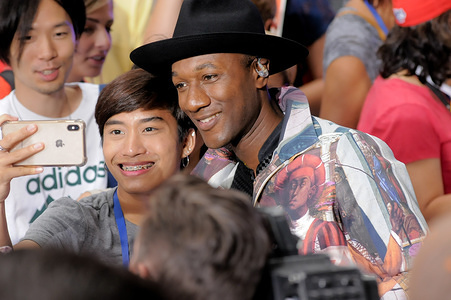 Singer-Songwriter Aloe Blacc takes a selfie with fan after his performance at Rockefeller Center in New York City.