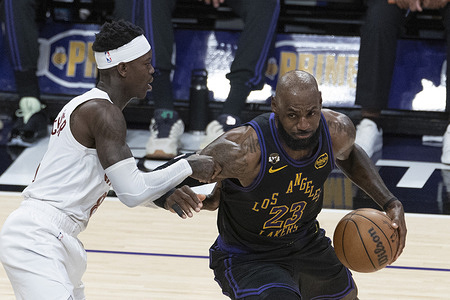 Los Angeles Lakers’ LeBron James (23) drives against Cleveland Cavaliers’ Dennis Schroder (8) during an NBA basketball game at Crypto.com Arena on Tuesday, March 31, 2026 in Los Angeles.