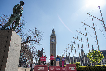 Protesters hold placards in front of the Big Ben during the demonstration on the Parliament Square. Members of the Dignity in Dying gathered at the Parliament Square in London, UK. It is a United Kingdom nationwide campaigning organisation and is fighting to change the law and allow terminally ill people control over their death and access to services at the end of life.