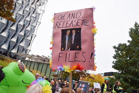 A protester holds a placard with a picture of Jeffrey Epstein and Trump and demanding the release of the Epstein Files during the 'No Kings' demonstration against Donald Trump. Crowds gathered outside the Embassy of USA in solidarity with the mass anti-Trump protests taking place across the USA.