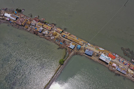 (Editors note: Image taken with a drone.) 
In coastal area's people take temporary shelter on the embankment after the landfall of cyclone Amphan.
At least 300,000 people remain homeless a week after cyclone Amphan ravaged south-western Bangladesh and eastern India and killed more than 100 people in both countries.