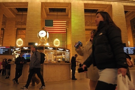 People walk past an information booth in Grand Central Terminal in Manhattan, New York City.