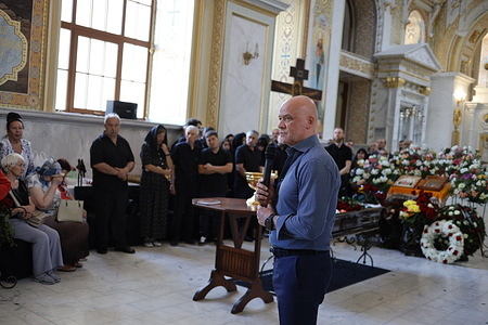 Acting Mayor of Odessa Gennadiy Trukhanov speaks during the farewell ceremony for Rouslan Bodelan at the Transfiguration Cathedral. The funeral of Rouslan Bodelan took place at the Transfiguration Cathedral. In August 1998, Bodelan was elected mayor of Odessa. He was re-elected as mayor in 2002, but the election results were challenged in the courts. In 2005, an Odessa court ruled the elections void and proclaimed Eduard Gurvits the legal Mayor of Odessa.