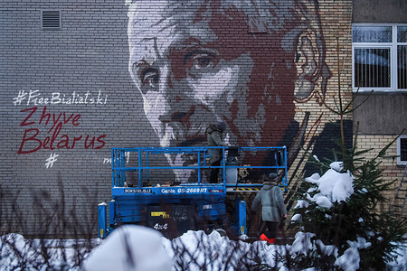 A mural depicting Nobel Peace Prize laureate Ales Bialiatski is seen painting on the Simonas Daukantas Pro-Gymnasium wall on Mindaugo Street in front of the Belarusian Embassy in Vilnius. The mural is dedicated to Belarus's imprisoned human rights defender, Nobel Peace Prize laureate Ales Bialiatski and other political prisoners held by the Belarus regime. It is placed on the Simonas Daukantas Pro-Gymnasium wall on Mindaugo Street in front of the Belarusian Embassy in Vilnius. The initiator of the project is the Ministry of Foreign Affairs of Lithuania. The mural was designed by the head of the art laboratory "Kiaurai Sienas" - Lina Šlipavičiūtė-Černiauskienė, and painted by the street artists collective "Gyva Grafika".