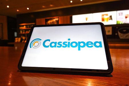 In this photo illustration, the Cassiopea logo is seen displayed on the screen of a tablet.