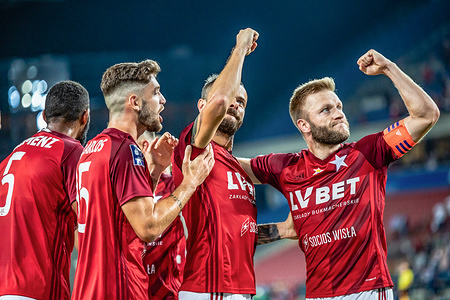 Jean Carlos (L), Pawel Brozek (C) and Jakub Blaszczykowski (R) of Wisla Krakow celebrate during the PKO Ekstraklasa League match between Wisla Krakow and Zaglebie Lubin at Stadion Miejski stadium.
(Final score: Wisla Krakow 4:2 Zaglebie Lubin)
