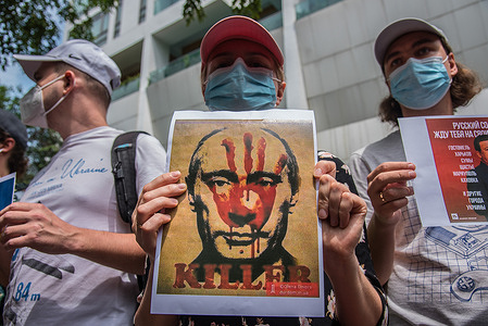 A Ukrainian protester holds a portrait of Vladimir Putin the President of Russia during the demonstration.
Ukrainian and Thai anti-war protesters gathered in front of the Embassy of Russia in Bangkok, to protest against Russia's invasion of Ukraine and calling for support of Ukraine after Russian military invaded Ukraine.