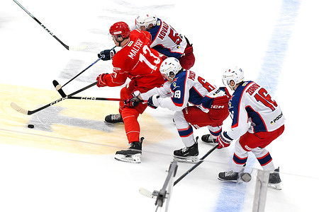 Nikolai Kovalenko (51) from CSKA Moscow and Mikhail Maltsev (13) from Spartak Moscow hockey club seen in action during the Kontinental Hockey League 2024/2025 match between Spartak Moscow and CSKA Moscow at Megasport Arena. (Final score: Spartak Moscow 0:2 CSKA Moscow)