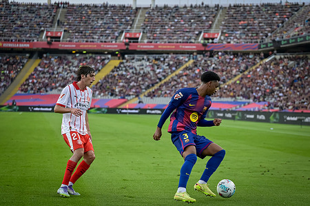 Bryan Gil (Girona FC) and Alejandro Balde (FC Barcelona) are seen during a La Liga EA Sports match between FC Barcelona and Girona FC at Estadi Olimpic Lluís Companys. Final Score: FC Barcelona 2:1 Girona FC
