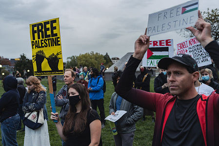 Protesters hold placards expressing their opinion during a demonstration in solidarity with Palestine at the Cal Anderson Park. The rally, which took place in Cal Anderson Park, attracted a diverse crowd carrying banners, flags, and signs bearing messages of peace and justice. Speakers at the event highlighted the importance of raising awareness about the long-standing conflict in the Middle East and its impact on the Palestinian people. They emphasized the need for a peaceful resolution that respects the rights and dignity of all parties involved.