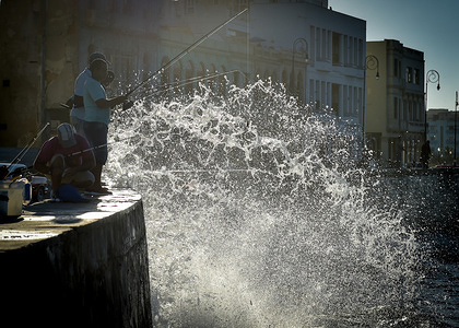 Fishermen are seen fishing at the world famous Malecon in Havana, Cuba.