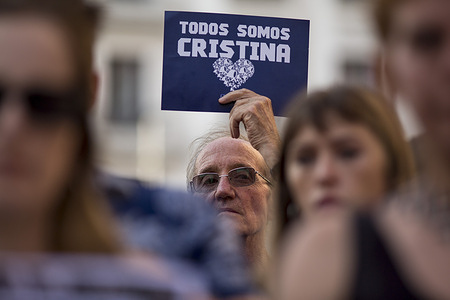 A protester holds a placard reading "We are all Cristina" in Spanish, during a rally of Argentines living in Spain in support of Cristina Kirchner. Argentina’s Supreme Court has upheld a six-year prison sentence and lifetime ban from public office for former President and Vice President Cristina Fernández de Kirchner over a 2022 corruption conviction in the "Vialidad" case. The charges involve fraudulent public works contracts awarded during her presidency. At age 72, she has requested to serve her sentence under house arrest and must report to the courts by June 18, 2025, to begin the process.