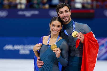 Gold medalist Laurence Fournier Beaudry and Guillaume Cizeron of France celebrate during the Figure Skating Ice Dance Free Dance Podium of the Milano Cortina 2026 Winter Olympics at Milano Ice Skating Arena in Milan
