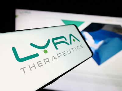 In this photo illustration, a smartphone with the logo of biotechnology company Lyra Therapeutics Inc. is seen on screen in front of website.