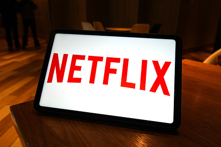 In this photo illustration, the Netflix logo is displayed on the screen of a smart tablet.