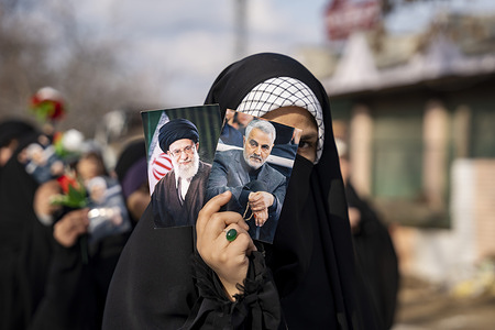 A Kashmiri Shia Muslim girl looks on as she holds photographs of Iranian leader Ayatollah Ali Khamenei and assassinated IRGC commander Qassem Soleimani during a rally. Shia Muslims, mostly students from Islamic schools, took part in a rally held in Kashmir, on the 15th of Sha‘ban, the eighth month of the Islamic calendar, to commemorate the birth anniversary of the final Shia Imam, Muhammad al-Mahdi. The day holds deep religious significance for Shia Muslims, who believe that Imam al-Mahdi is in occultation and will reappear before the end of time to establish peace, justice, and moral order in the world. Moreover, people were carrying pictures of Iranian leader Ayatollah Ali Khamenei in a show of support, amid threats by U.S. President Donald Trump to attack Iran.