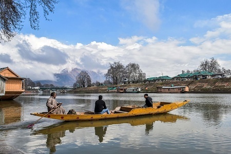 A boatman ferry passengers on a partly cloudy day in Srinagar, Indian administered Kashmir. Ahead of prediction of rain and snow from Thursday due to a fresh Western Disturbance (WD), sun came out much to the delight of the people in the afternoon in Kashmir valley."Widespread rainfall in the plains and moderate snowfall occurred in the higher reaches of Kashmir during the last 12 hours. Inclement weather is likely to continue during the next 24 hours.