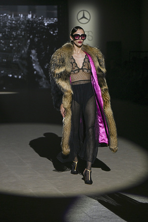 A model walks the runway wearing a design by Odette Alvarez during Mercedes-Benz Fashion Week de Madrid in IFEMA.